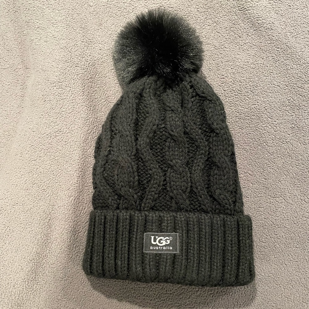 Black hat with fur puff